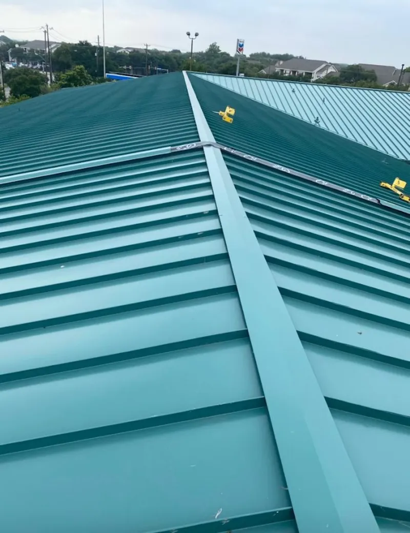 Green commercial metal roof ridge and valley for Metal Roof Repair in East Goshen